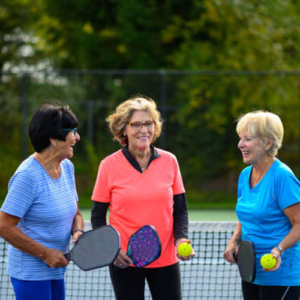 Seniors staying young about to play pickleball 